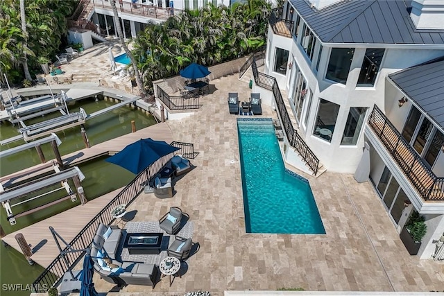 152 Conners Ave, Naples, FL 34108 - view of pool with a water view, boat lift, a dock, a patio, and a fenced in pool
