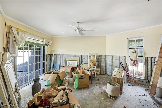 misc room featuring ornamental molding, a wealth of natural light, and ceiling fan