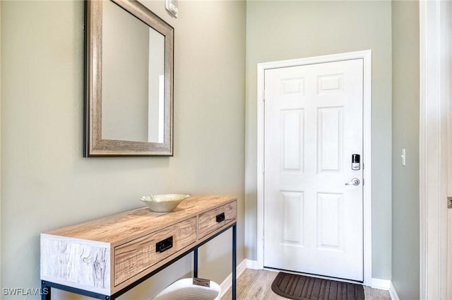 8680 Cedar Hammock Cir Unit 132, Naples, FL 34112 - foyer entrance with baseboards and wood finished floors