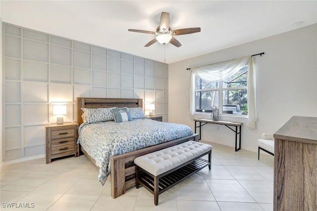bedroom with baseboards, a ceiling fan, and light tile patterned flooring