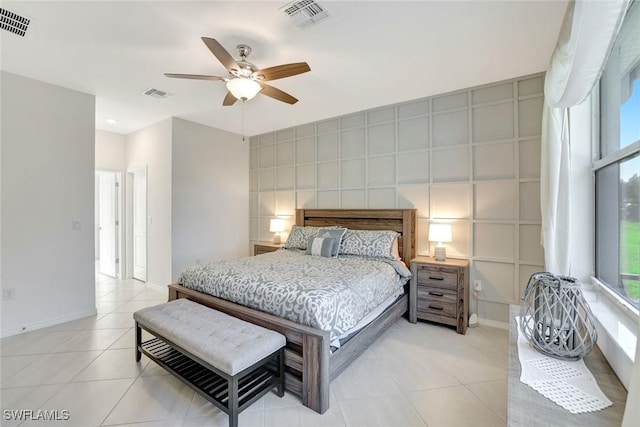 bedroom with visible vents, a ceiling fan, and light tile patterned flooring