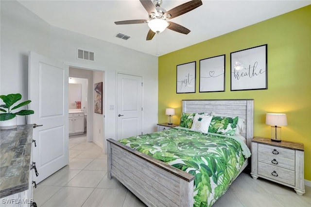 bedroom featuring light tile patterned floors, visible vents, baseboards, and a ceiling fan