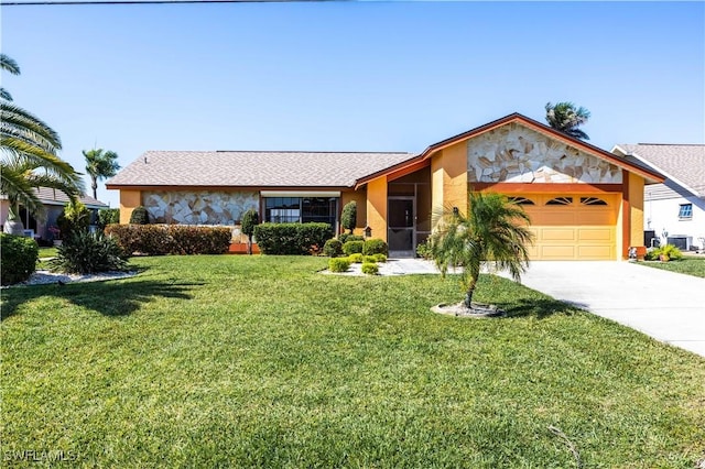 view of front of property with stucco siding, driveway, a front lawn, central AC unit, and a garage