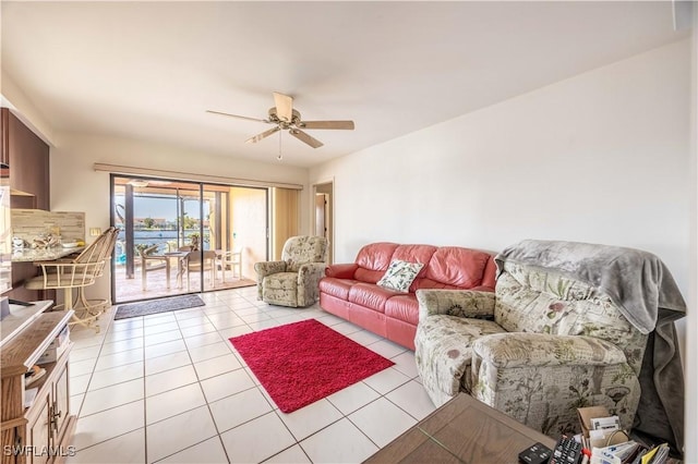 living room with ceiling fan and light tile patterned flooring