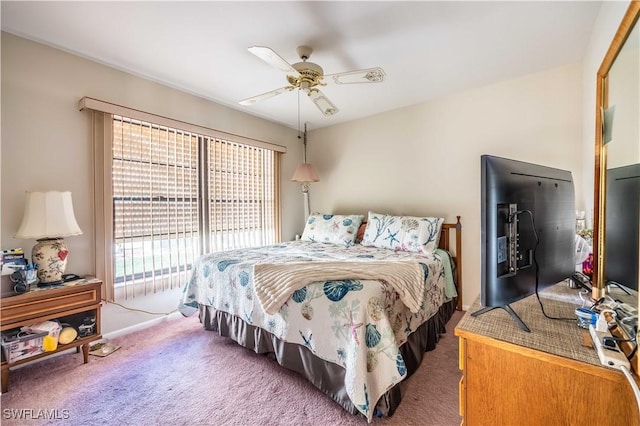bedroom with ceiling fan, access to exterior, and carpet floors