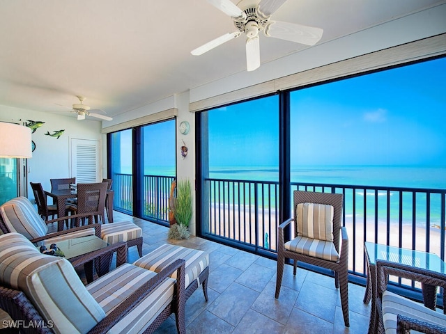 1255 Gulf Shore Blvd N Unit 3N, Naples, FL 34102 - sunroom featuring a water view and stone tile floors