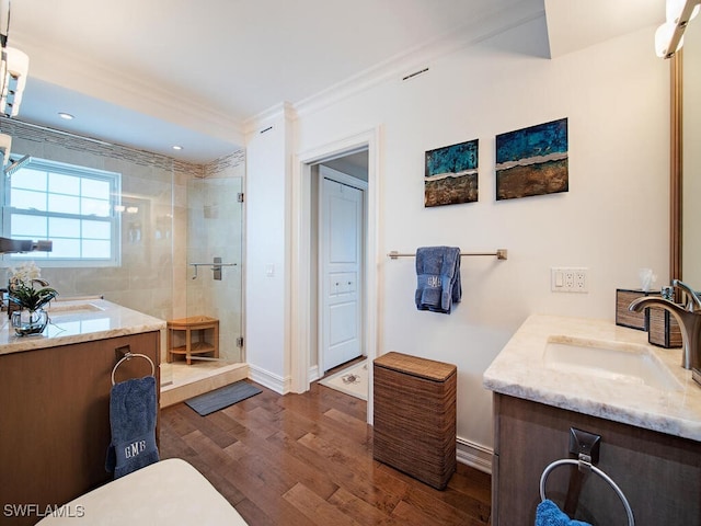 1255 Gulf Shore Blvd N Unit 3N, Naples, FL 34102 - bathroom featuring a shower stall, vanity, crown molding, wood finished floors, and baseboards