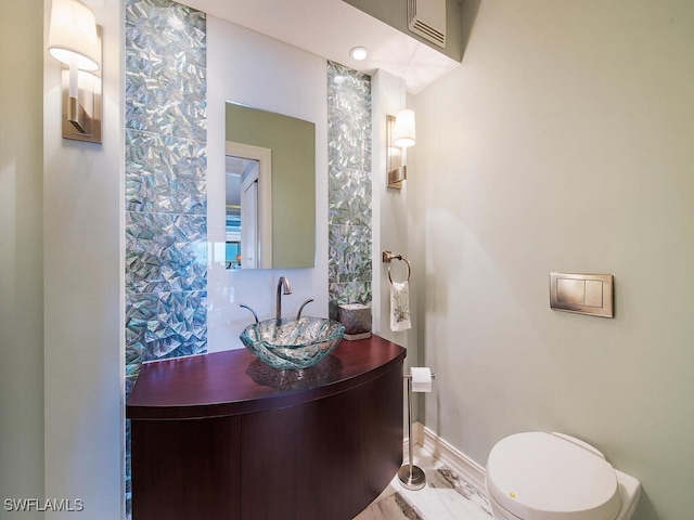 1255 Gulf Shore Blvd N Unit 3N, Naples, FL 34102 - bathroom with vanity, baseboards, marble finish flooring, and toilet