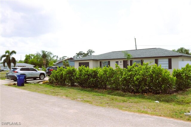 18254 Lowe Dr, Fort Myers, FL 33967 - single story home with an attached garage and stucco siding