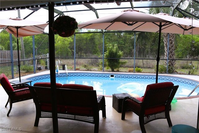 18254 Lowe Dr, Fort Myers, FL 33967 - pool featuring a patio, glass enclosure, and fence