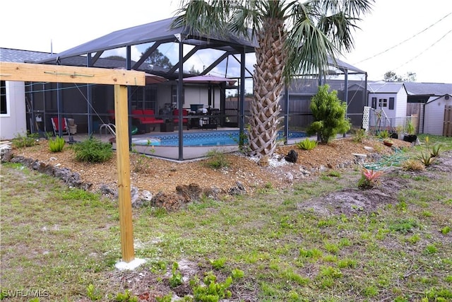 18254 Lowe Dr, Fort Myers, FL 33967 - view of yard with a patio area, glass enclosure, and an outdoor pool