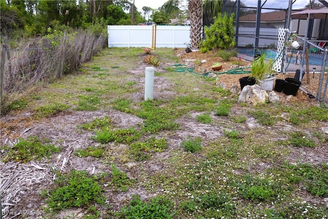 18254 Lowe Dr, Fort Myers, FL 33967 - view of yard with fence and glass enclosure