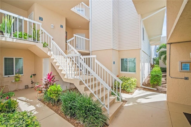 2651 Citrus Lake Dr Unit D203, Naples, FL 34109 - view of exterior entry featuring stucco siding