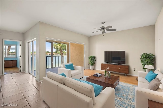 2651 Citrus Lake Dr Unit D203, Naples, FL 34109 - living area with baseboards and a ceiling fan