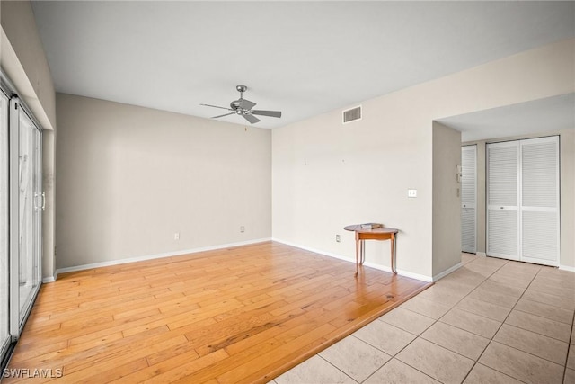 2651 Citrus Lake Dr Unit D203, Naples, FL 34109 - interior space with light wood finished floors, visible vents, a ceiling fan, and baseboards