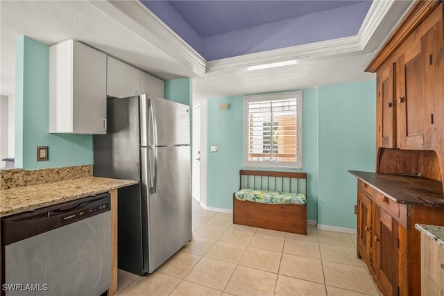 2651 Citrus Lake Dr Unit D203, Naples, FL 34109 - kitchen featuring light tile patterned floors, baseboards, appliances with stainless steel finishes, and a raised ceiling