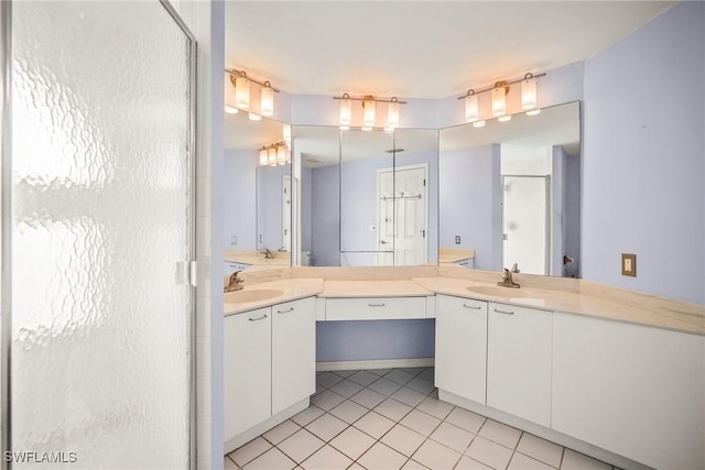 2651 Citrus Lake Dr Unit D203, Naples, FL 34109 - bathroom with vanity, tile patterned flooring, and a shower with door