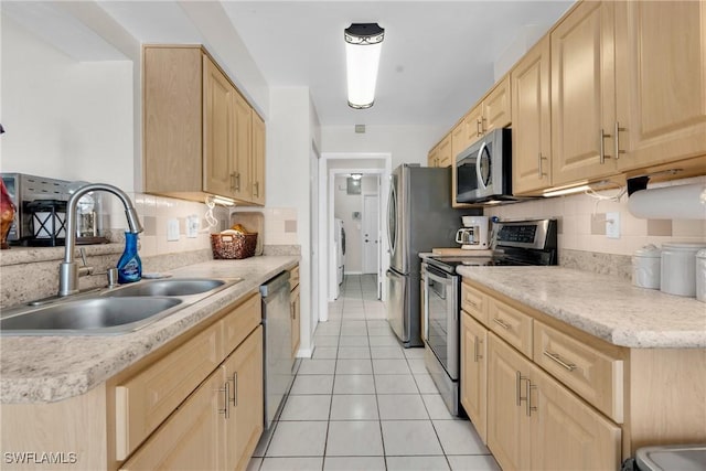 1514 Canal St, Lehigh Acres, FL 33936 - kitchen featuring light brown cabinets, appliances with stainless steel finishes, and a sink