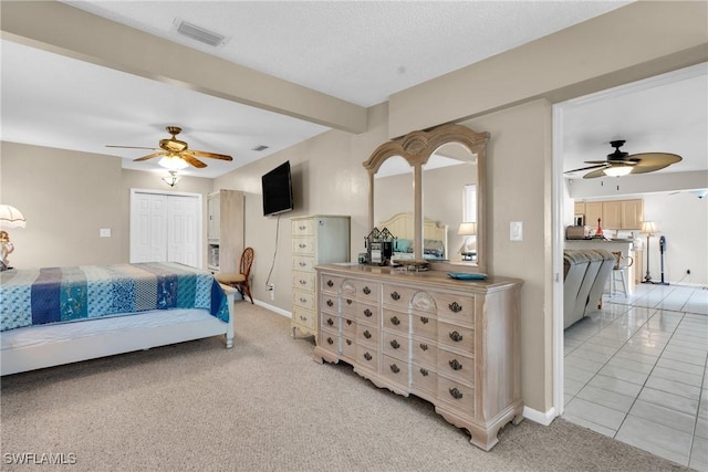 1514 Canal St, Lehigh Acres, FL 33936 - bedroom with baseboards, a ceiling fan, visible vents, and light carpet