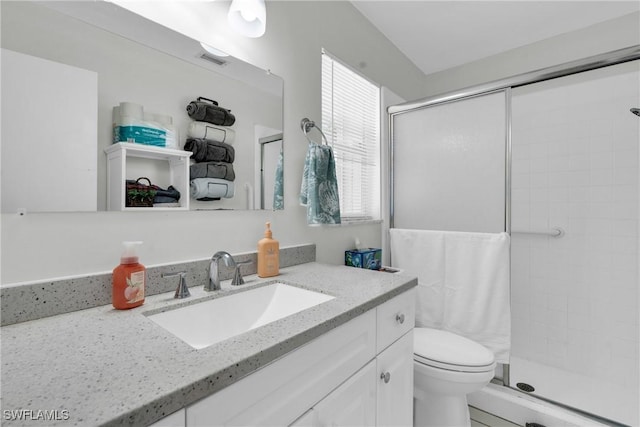 1514 Canal St, Lehigh Acres, FL 33936 - bathroom featuring a shower stall, visible vents, toilet, and vanity
