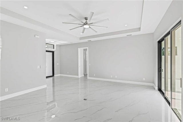 1819 NW 19th Ave, Cape Coral, FL 33993 - unfurnished room featuring recessed lighting, ceiling fan, a raised ceiling, marble finish floor, and baseboards