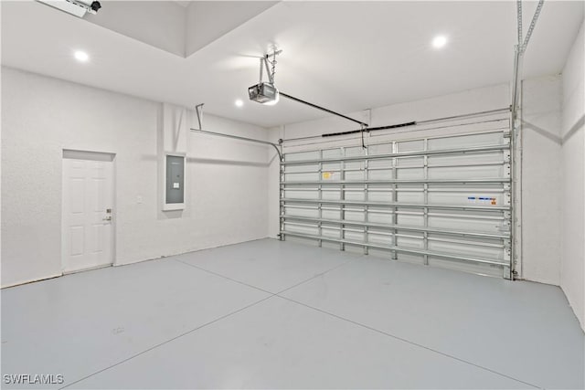 1819 NW 19th Ave, Cape Coral, FL 33993 - garage featuring a garage door opener, recessed lighting, and electric panel
