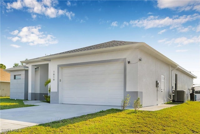 1819 NW 19th Ave, Cape Coral, FL 33993 - view of home's exterior featuring driveway, a yard, an attached garage, and stucco siding