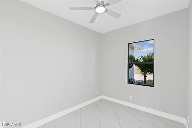 1819 NW 19th Ave, Cape Coral, FL 33993 - spare room featuring marble finish floor, a ceiling fan, and baseboards