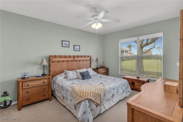 317 Sunrise Cay Unit 1-102, Naples, FL 34114 - bedroom featuring light carpet and a ceiling fan