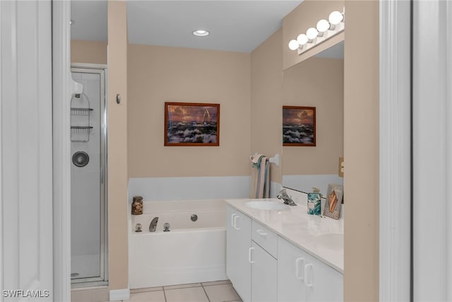 317 Sunrise Cay Unit 1-102, Naples, FL 34114 - bathroom featuring a shower stall, a bath, tile patterned flooring, a sink, and double vanity