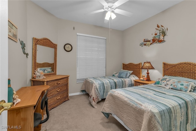 317 Sunrise Cay Unit 1-102, Naples, FL 34114 - bedroom with light carpet, ceiling fan, and baseboards