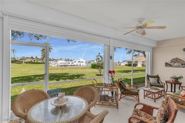317 Sunrise Cay Unit 1-102, Naples, FL 34114 - sunroom featuring a residential view and a ceiling fan