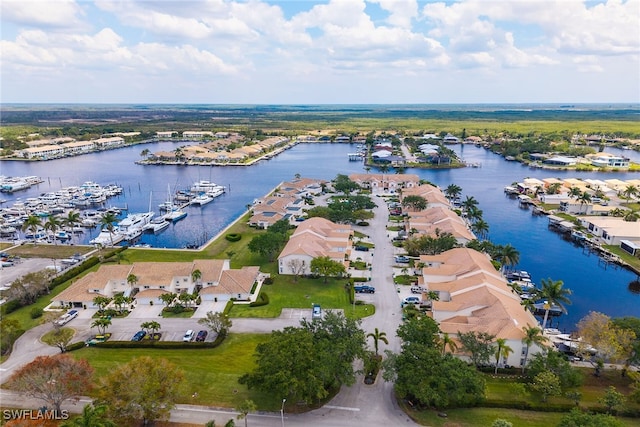 317 Sunrise Cay Unit 1-102, Naples, FL 34114 - drone / aerial view with a residential view and a water view