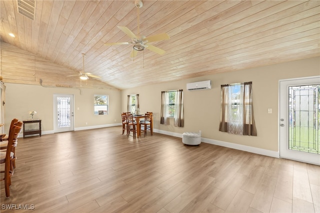 interior space with ceiling fan, wood ceiling, wood finished floors, an AC wall unit, and baseboards