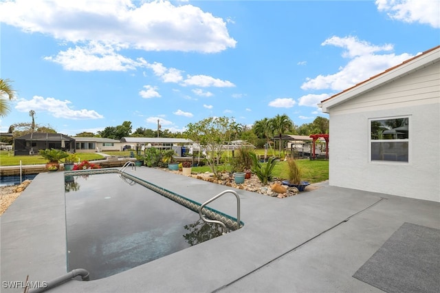 view of pool featuring a patio area