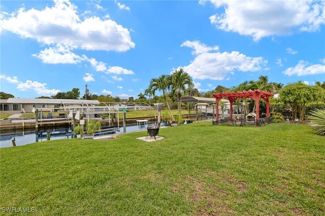 view of yard featuring a water view, a boat dock, boat lift, and a pergola