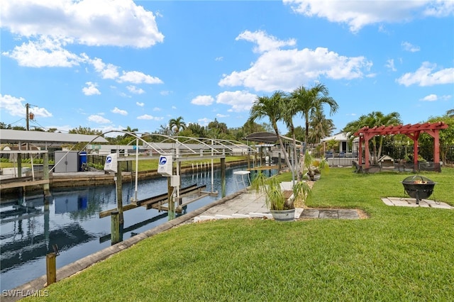 dock area with boat lift, a pergola, a fire pit, a water view, and a yard