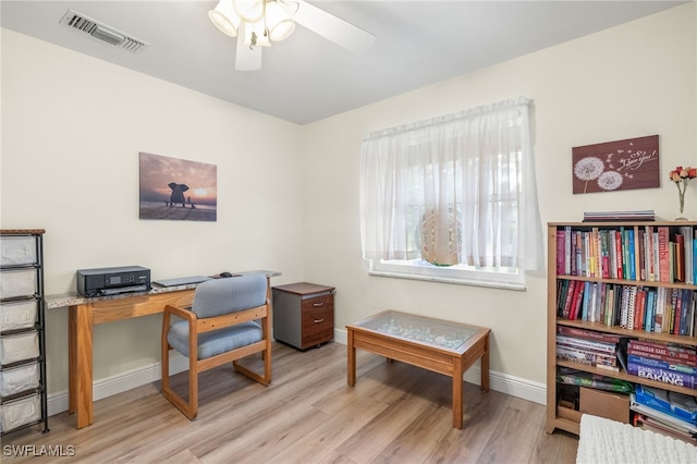 office featuring visible vents, baseboards, a ceiling fan, and wood finished floors