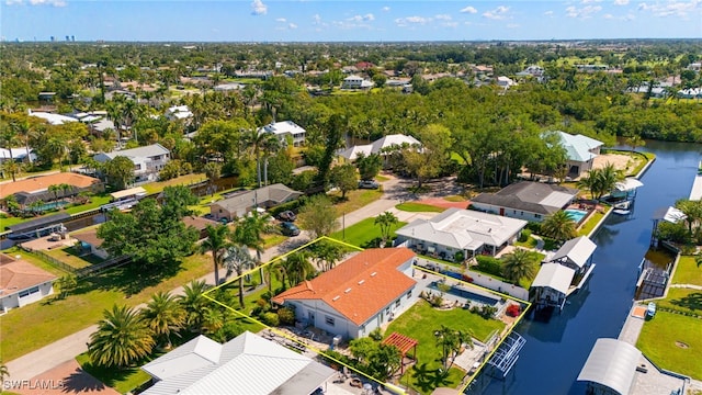 drone / aerial view with a residential view and a water view