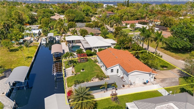 aerial view with a residential view and a water view