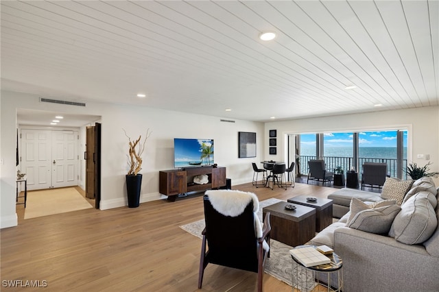 2901 Gulf Shore Blvd N Unit 803S, Naples, FL 34103 - living area featuring light wood-style floors, recessed lighting, and baseboards