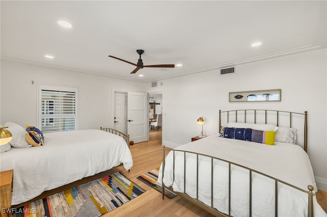 bedroom featuring visible vents, baseboards, light wood-type flooring, and recessed lighting