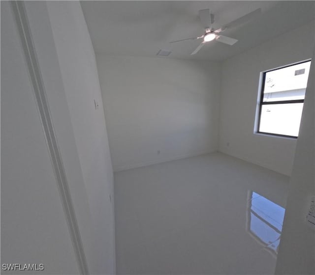 spare room with a ceiling fan