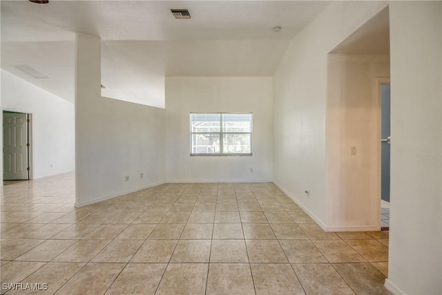 4355 SW 21st Pl, Cape Coral, FL 33914 - unfurnished room with vaulted ceiling and tile patterned flooring