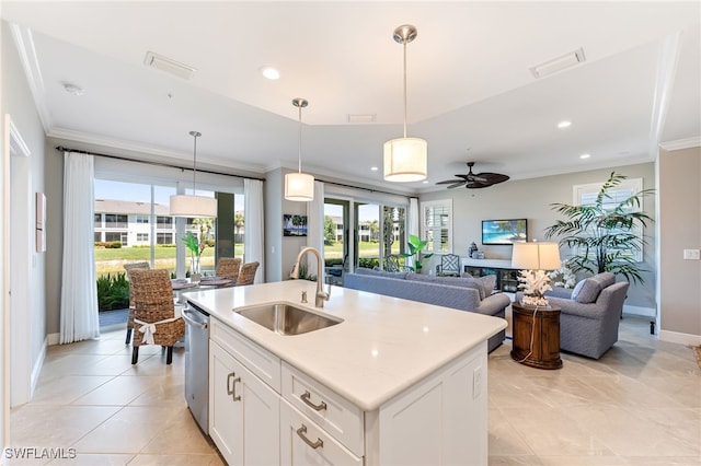 kitchen featuring stainless steel dishwasher, visible vents, a sink, and ornamental molding