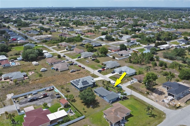 birds eye view of property with a residential view