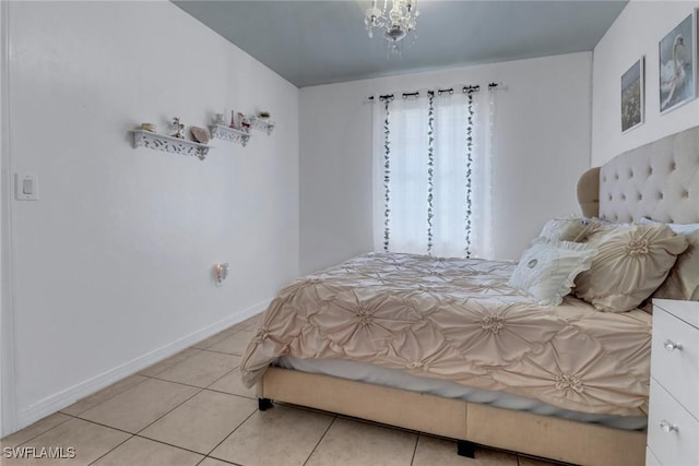 tiled bedroom featuring baseboards