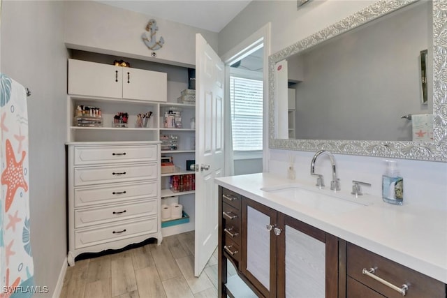 bathroom featuring vanity and wood finished floors
