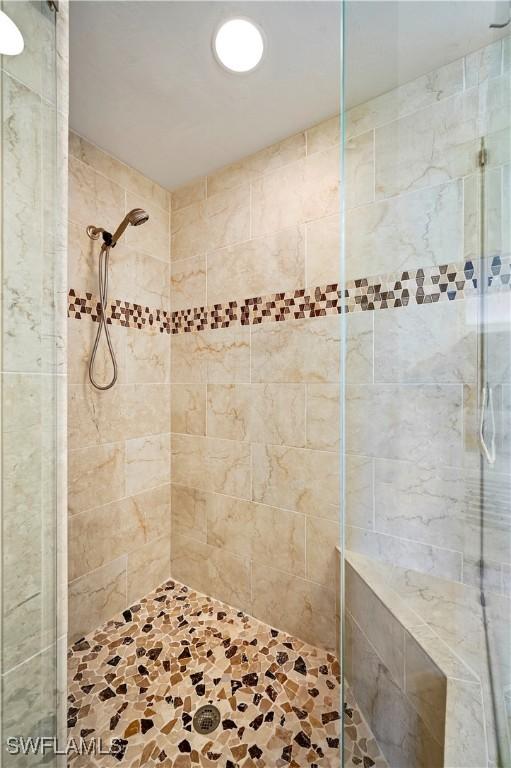 bathroom with a shower stall
