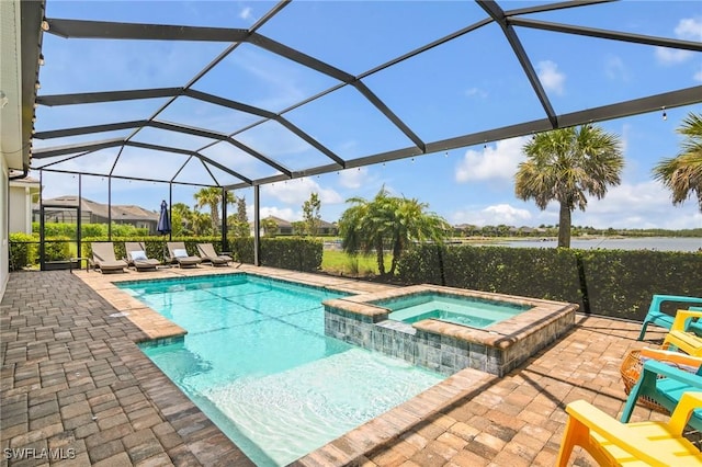 13504 Blue Bay Cir, Miromar Lakes, FL 33913 - view of swimming pool featuring a water view, a patio area, a pool with connected hot tub, and glass enclosure